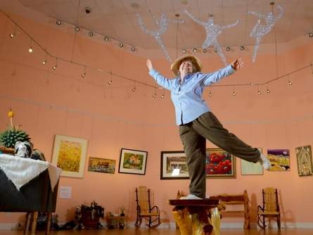 Marietta Lee Standing On Stool In Art Gallery